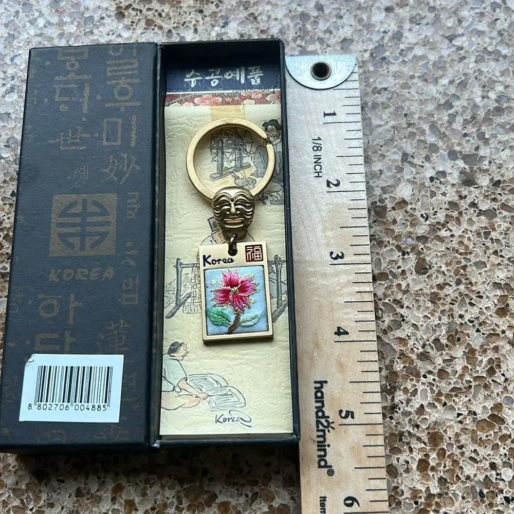 Gold Tone Korean Mask Keychain with Flower 🌺 Tag In Box 🗃️ engraved Korea back